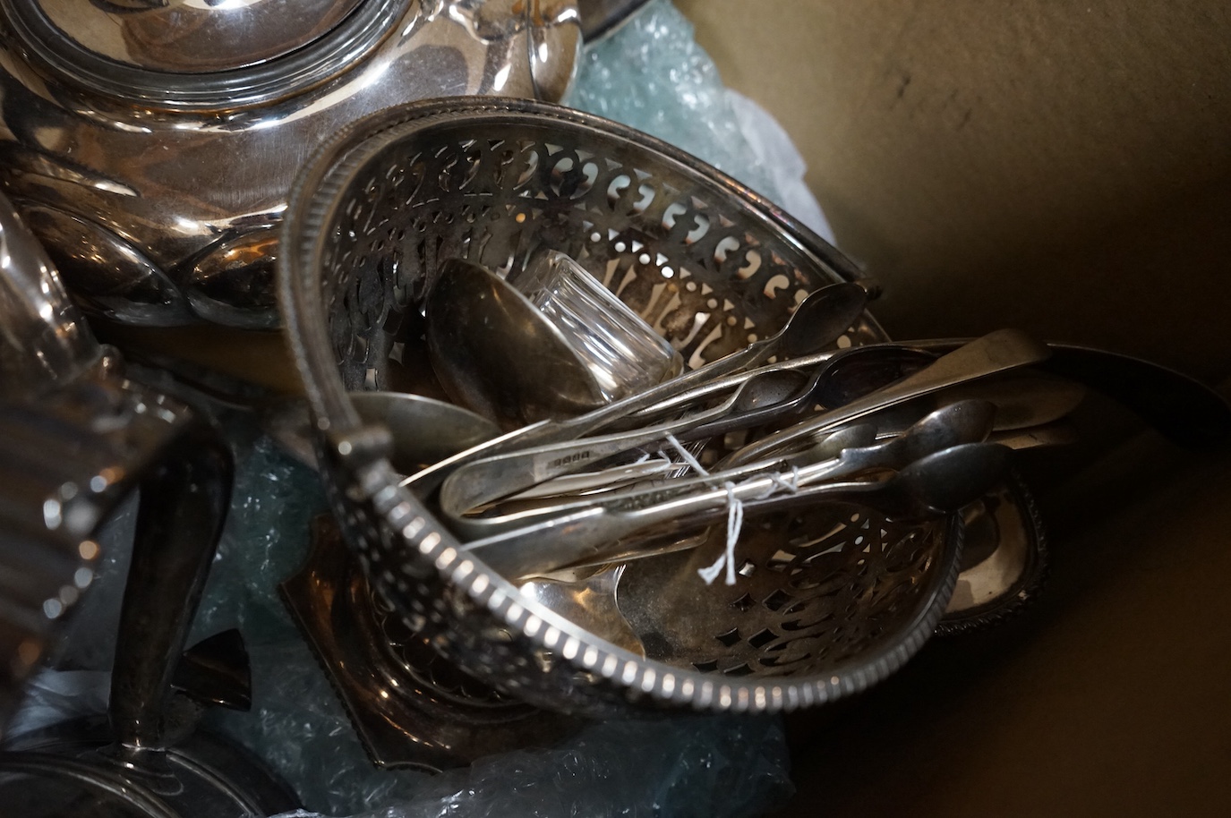 A group of assorted plated wares including an Old Sheffield plated tankard, tea kettle, teapot, flatware etc.
